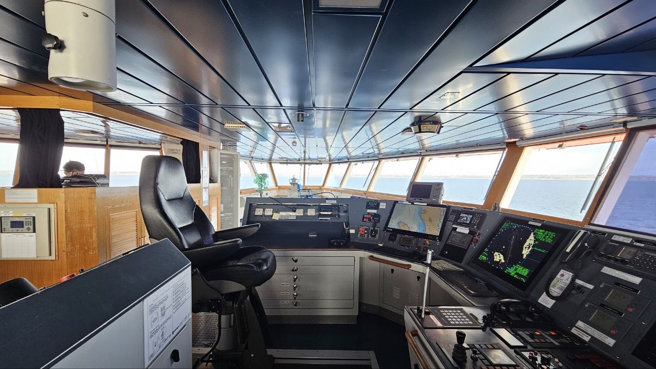 Night bridge watch: radar display and the view ahead of the bow