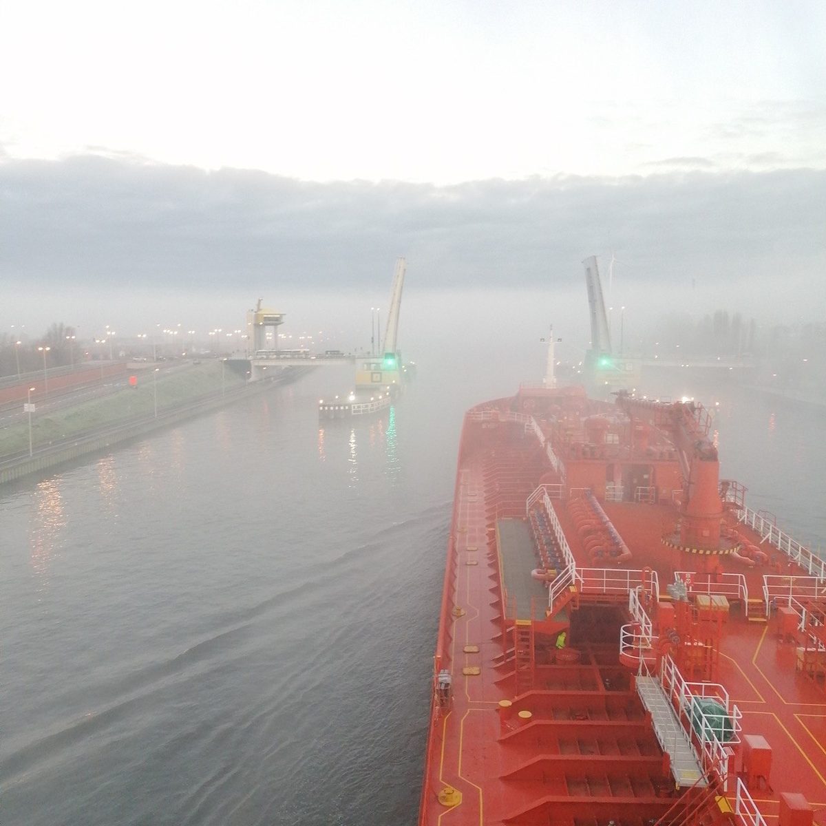 Tanker approaching a bascule bridge in fog